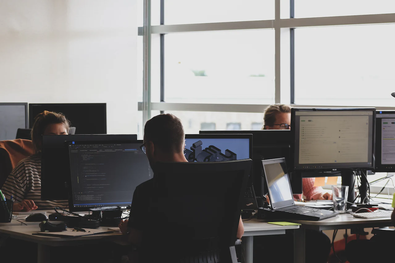 An agency team working at computers in an office